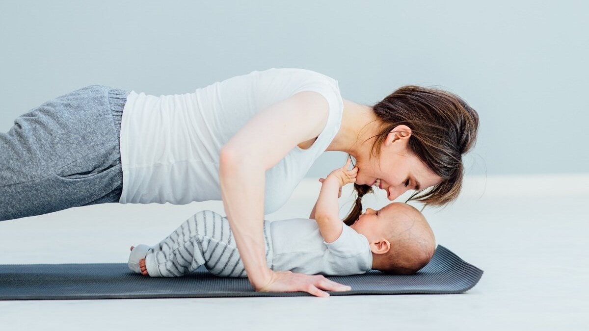 young mother does yoga exercis